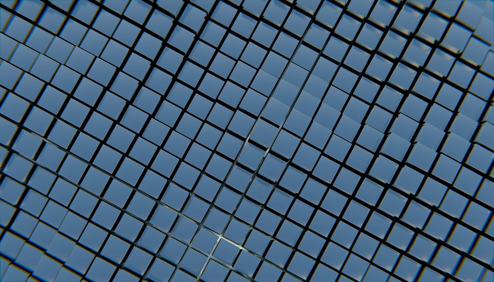 Modern building with reflective glass facade showing sky reflections