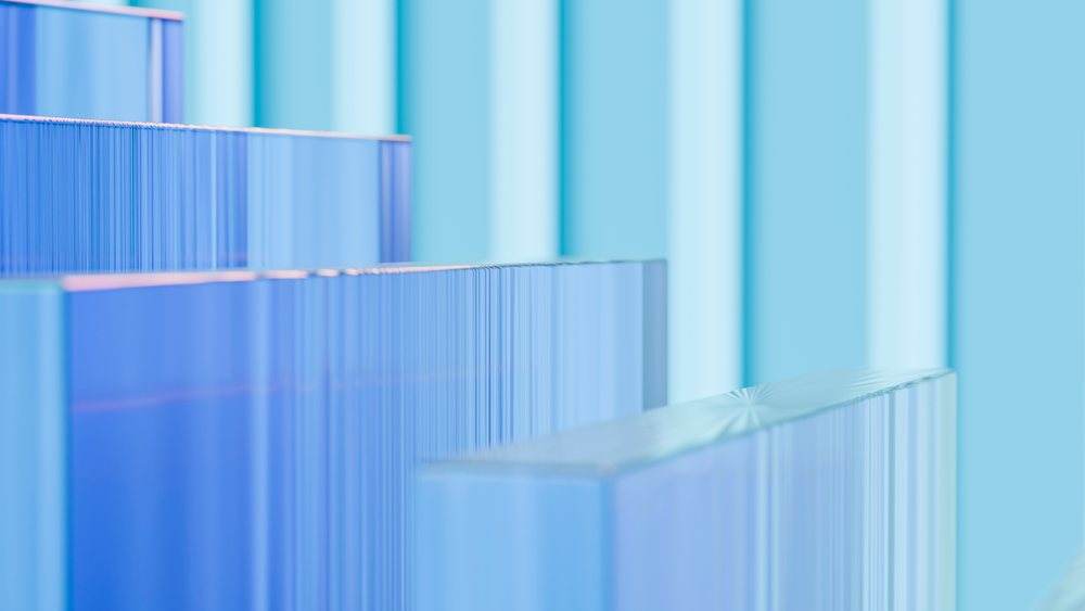 Blue transparent glass blocks stacked in geometric arrangement