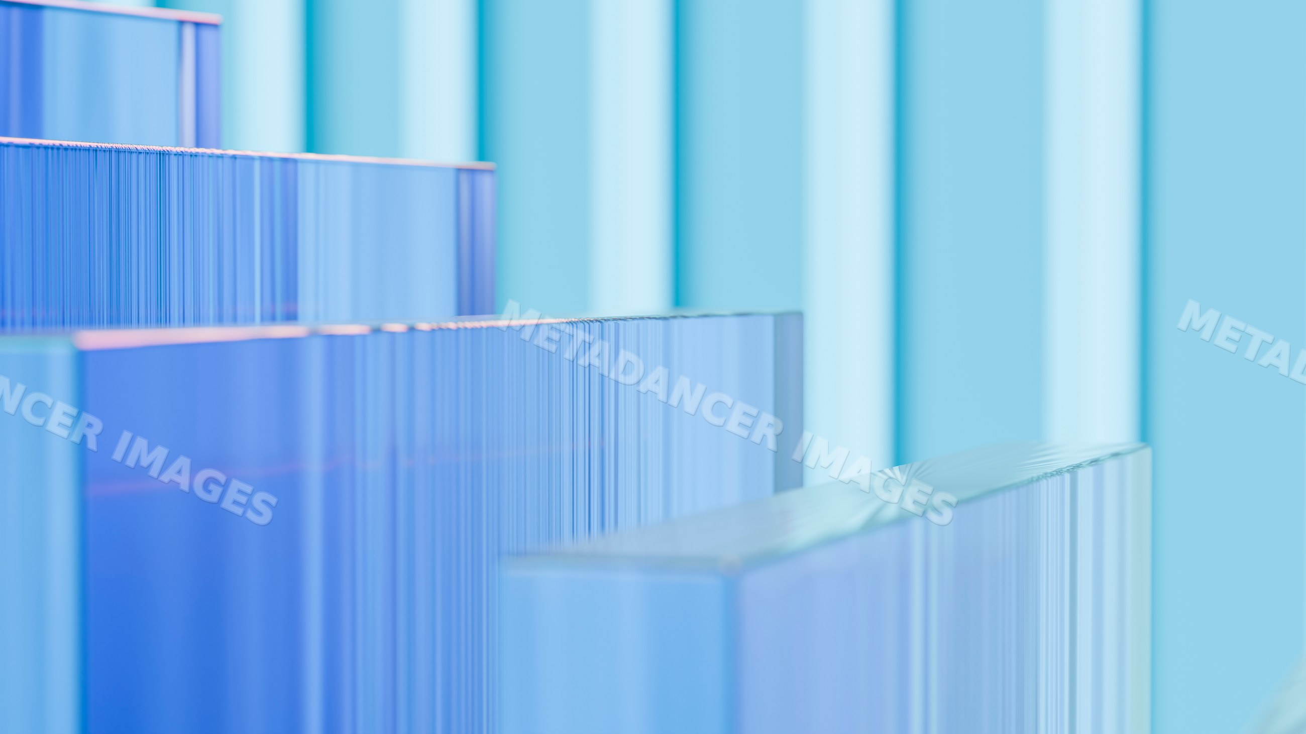 Blue transparent glass blocks stacked in geometric arrangement