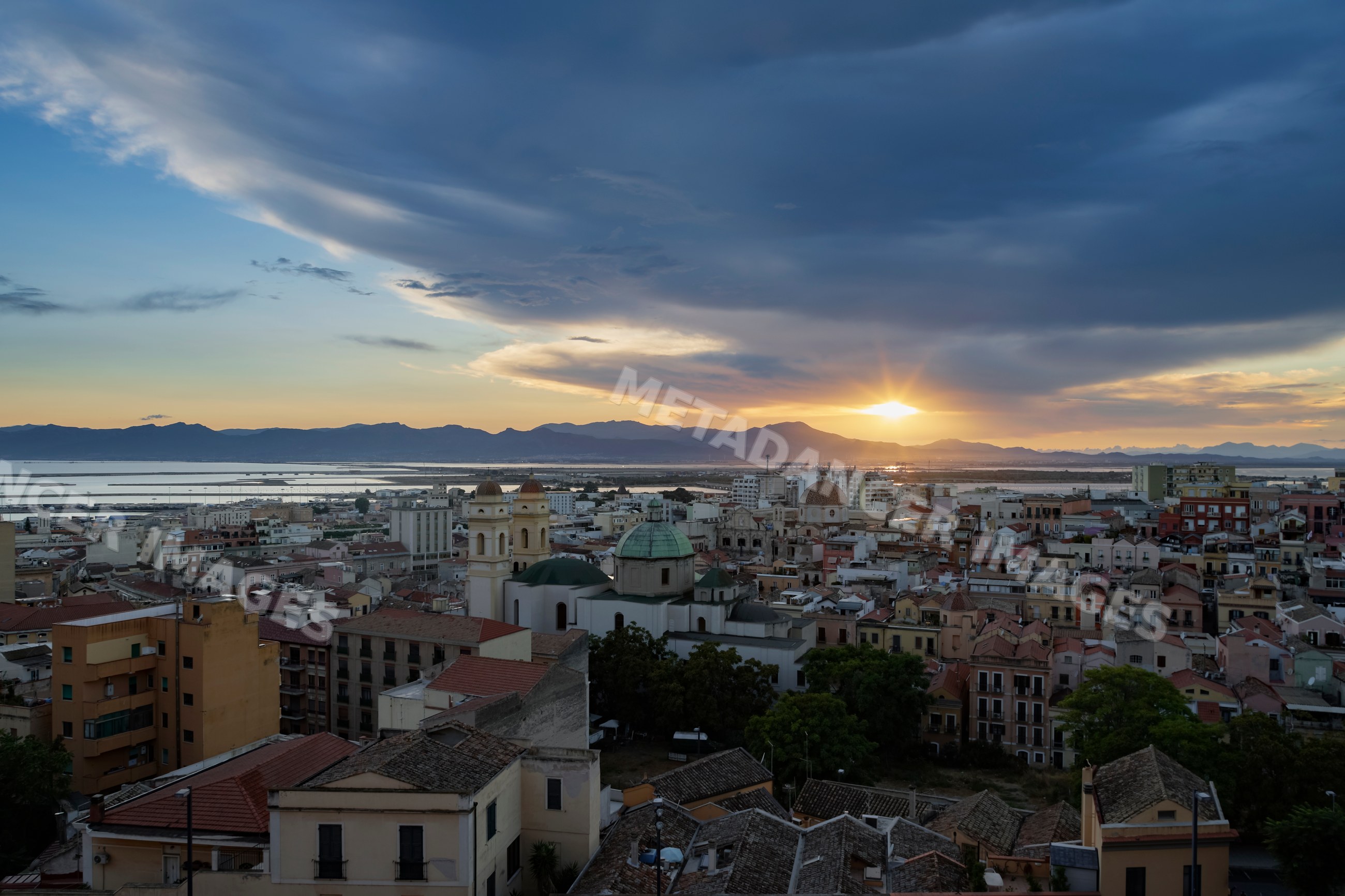 Sunset over cityscape and mountains in cagliari Sardinia Italy