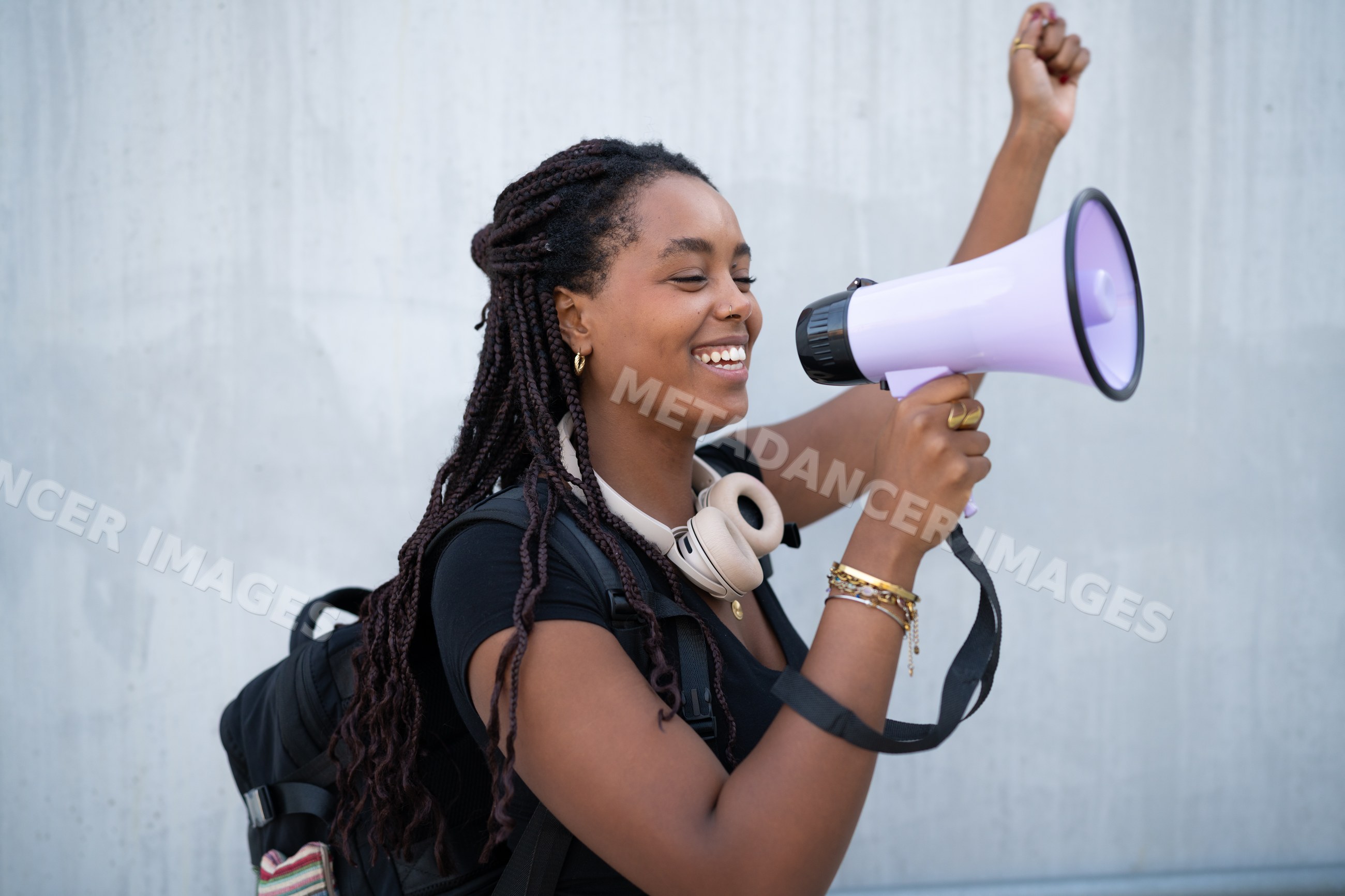 A young African American woman enthusiastically speaking