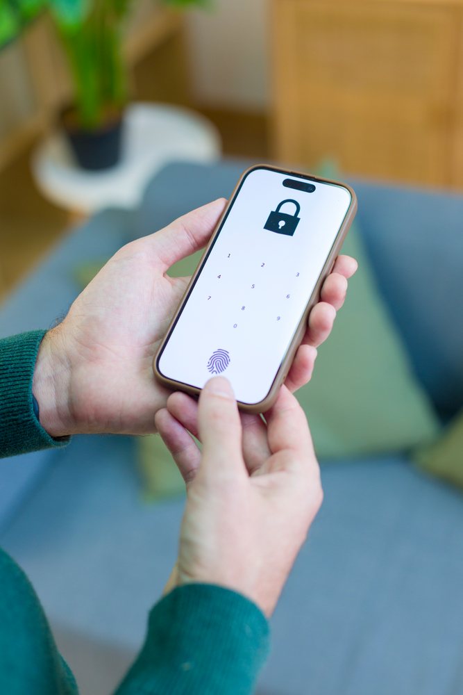 Smartphone displaying password lock screen with fingerprint
