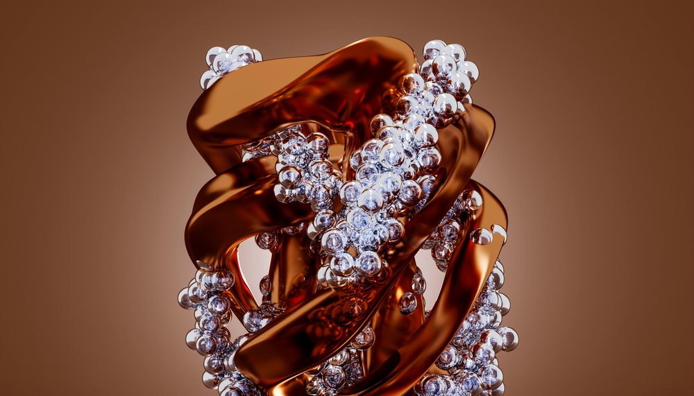 Abstract sculpture with metallic ribbons and silver spheres on brown