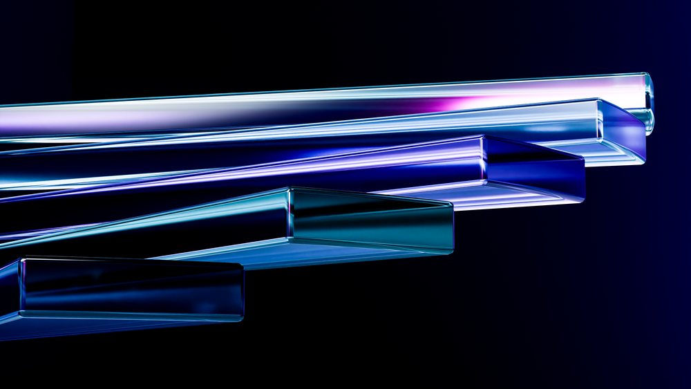 Stacked transparent rectangular glass bars with colorful reflections