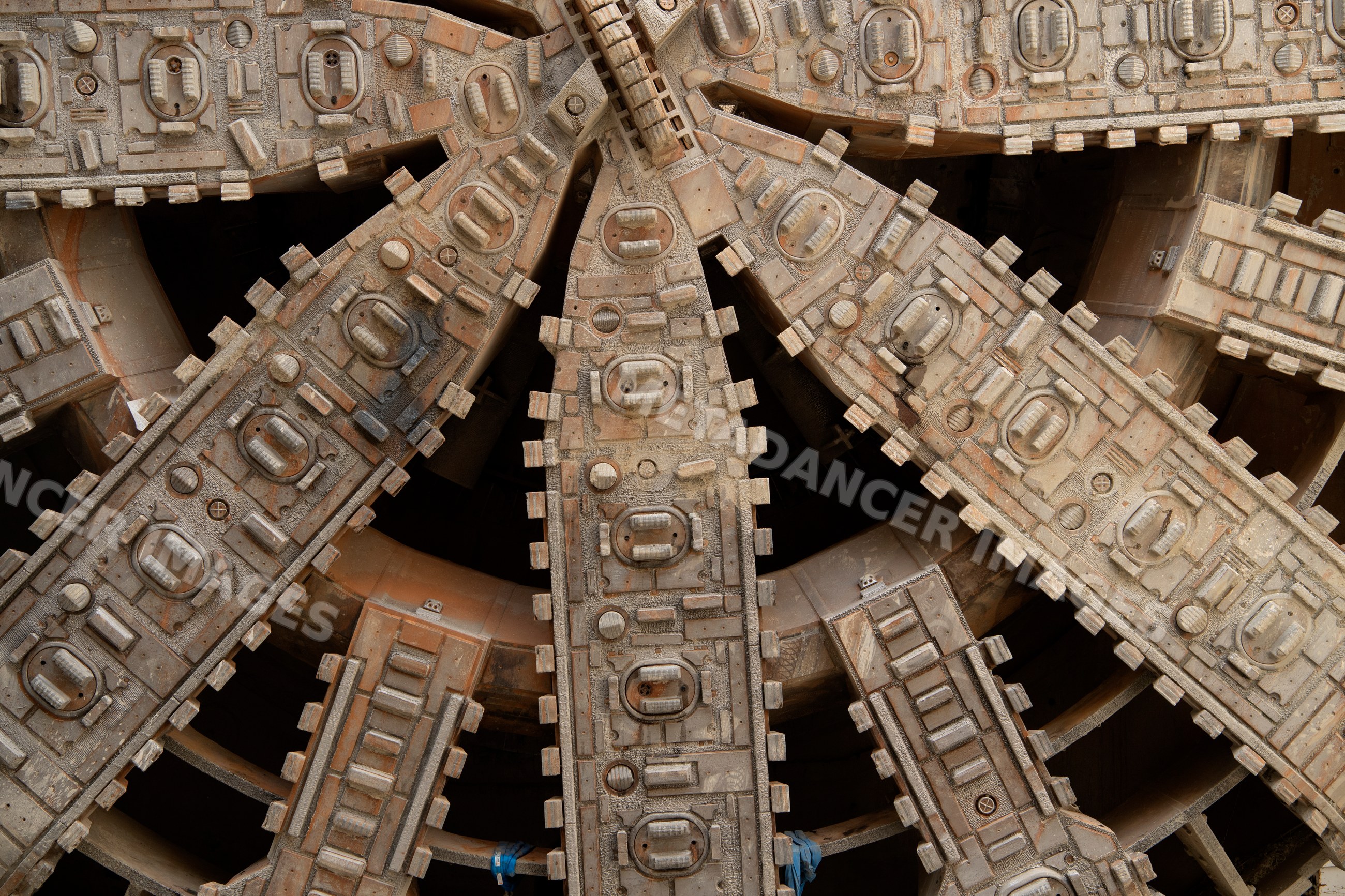 Close-up of tunnel boring machine cutting head drilling underground