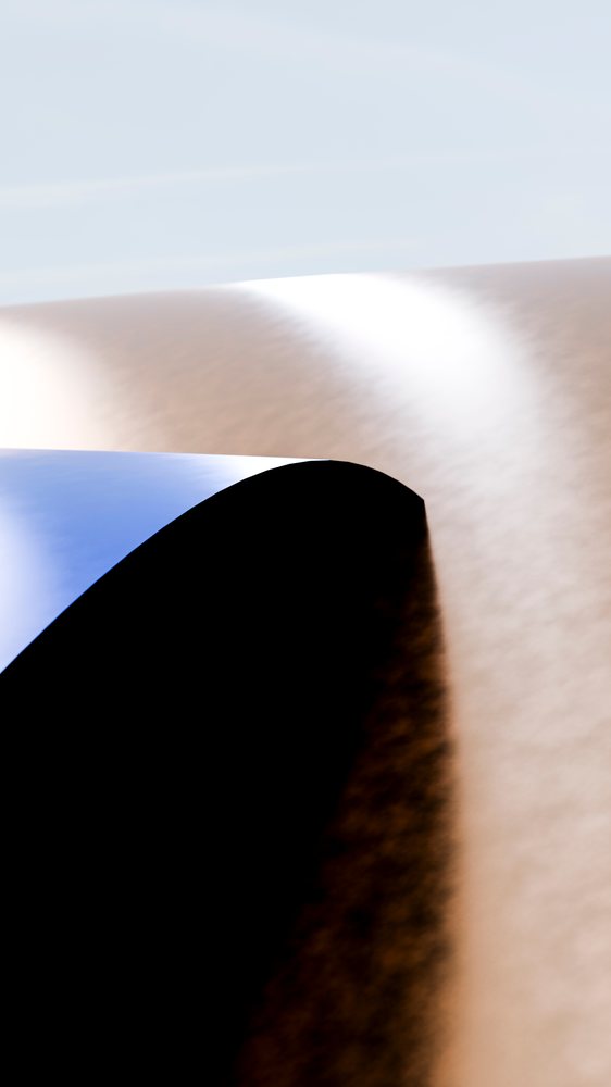 Blue and brown paper curls forming abstract curves and shadows