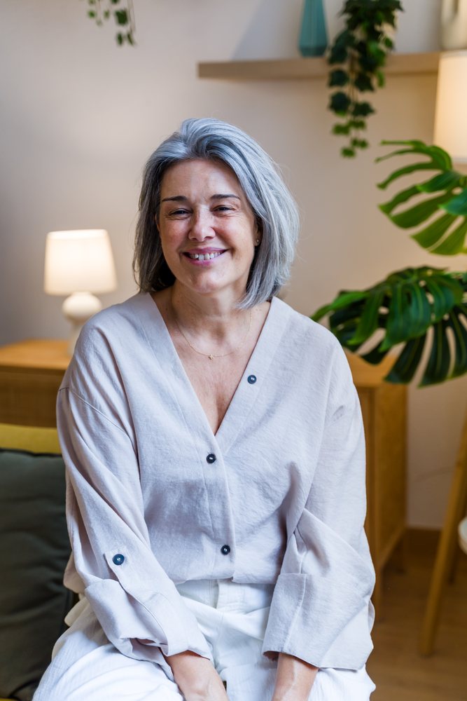White woman smiling indoors