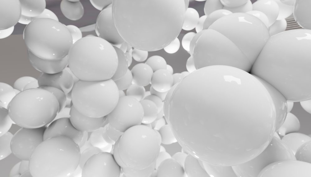 Glossy white 3d spheres floating in an abstract composition