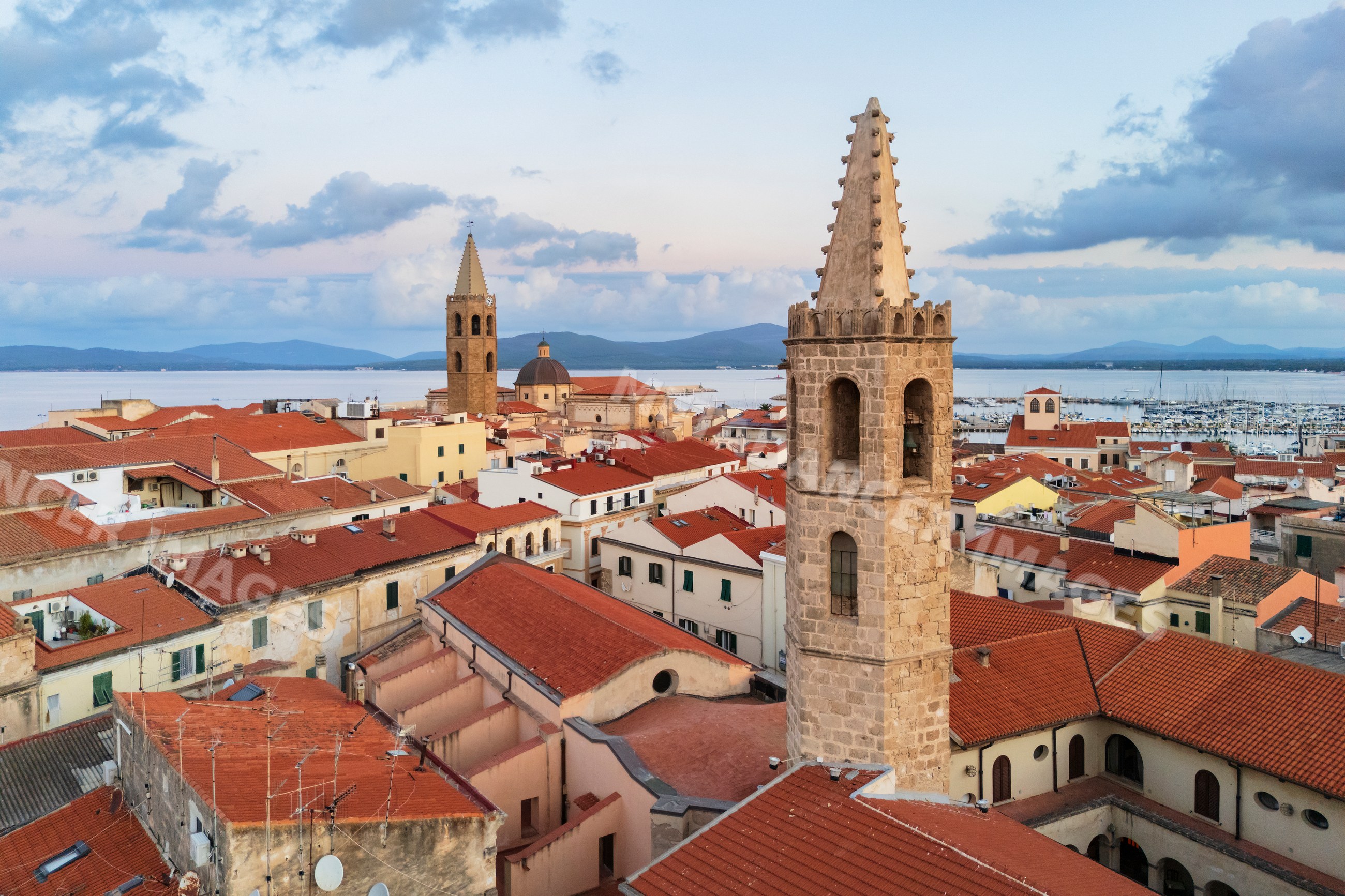 Monastery of San Francesco and cathedral towers in alghero at Dawn