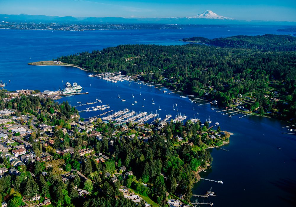 Eagle Harbor marina with boats and mount rainier in the distance