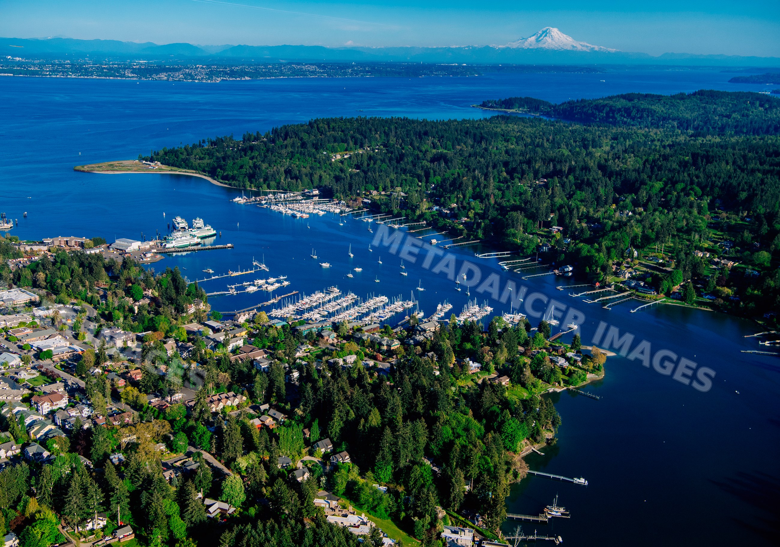 Eagle Harbor marina with boats and mount rainier in the distance
