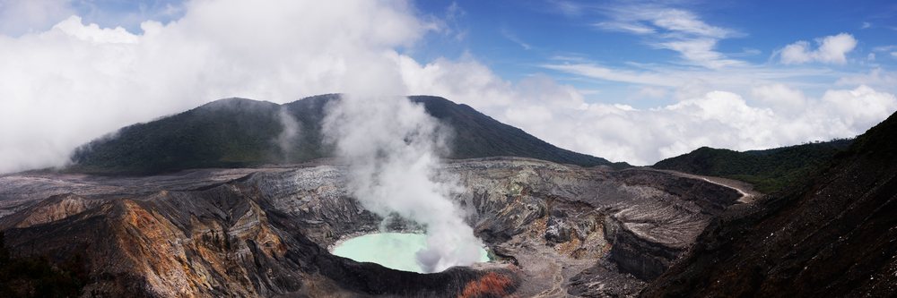 Poas volcano crater with steam and rugged volcanic landscape