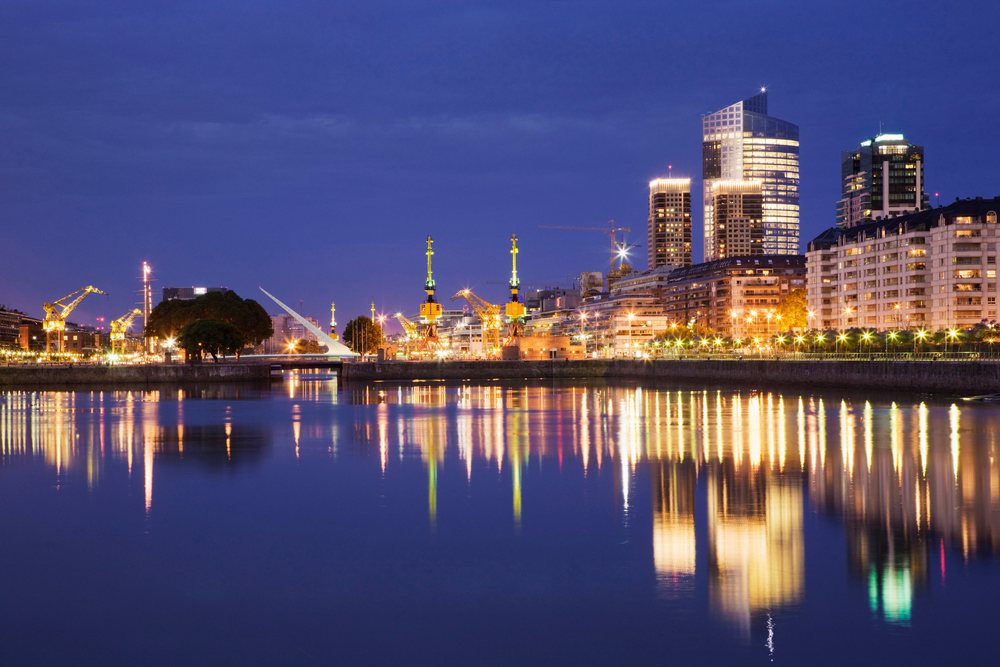 Puerto madero waterfront reflecting city lights at night