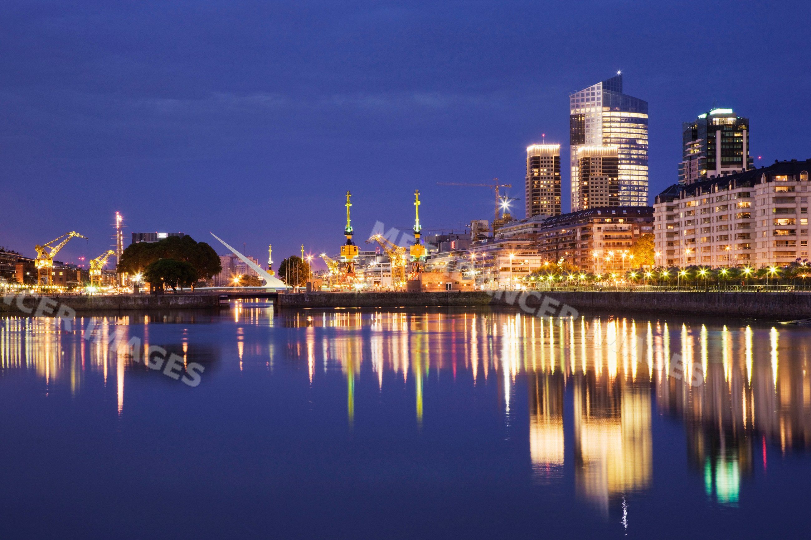 Puerto madero waterfront reflecting city lights at night