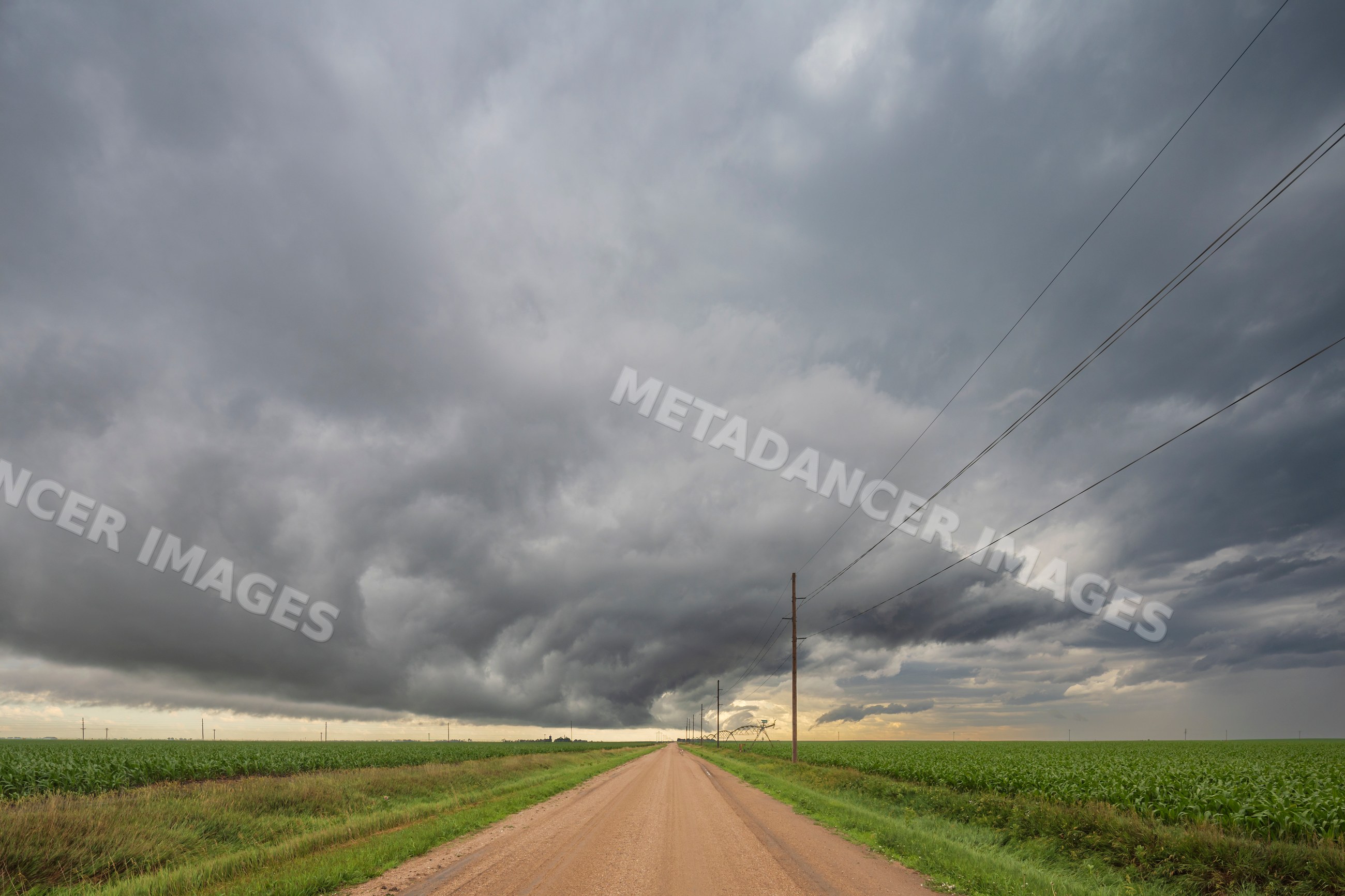 Roll cloud over a farm road in funk nebraska