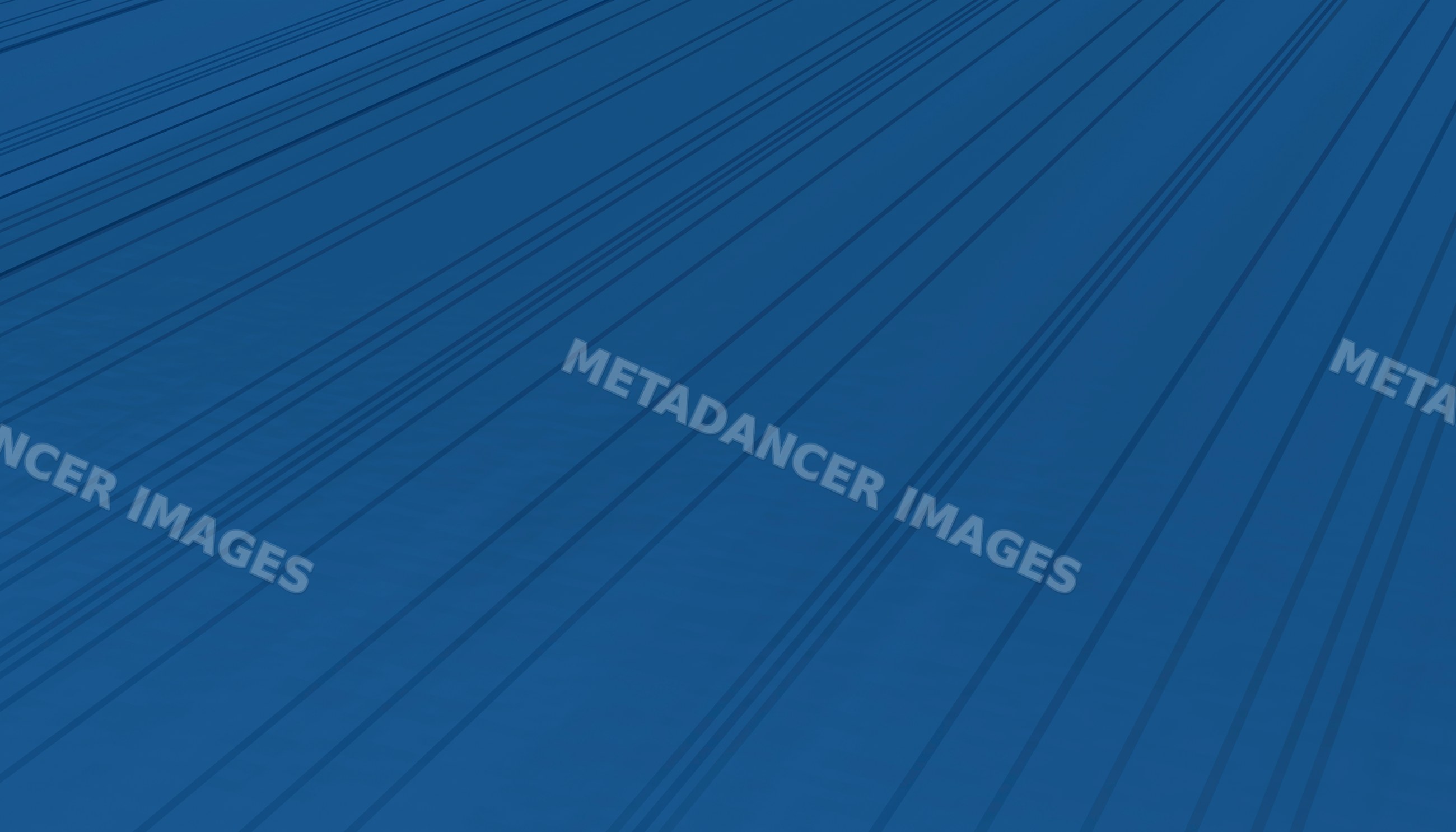 Blue surface with dark linear shadows creating geometric abstract