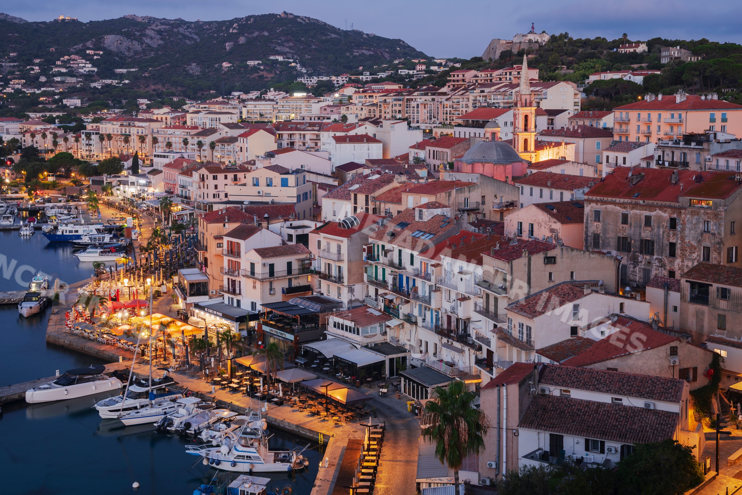 Calvi harbor with boats docked at Dawn in corsica, france