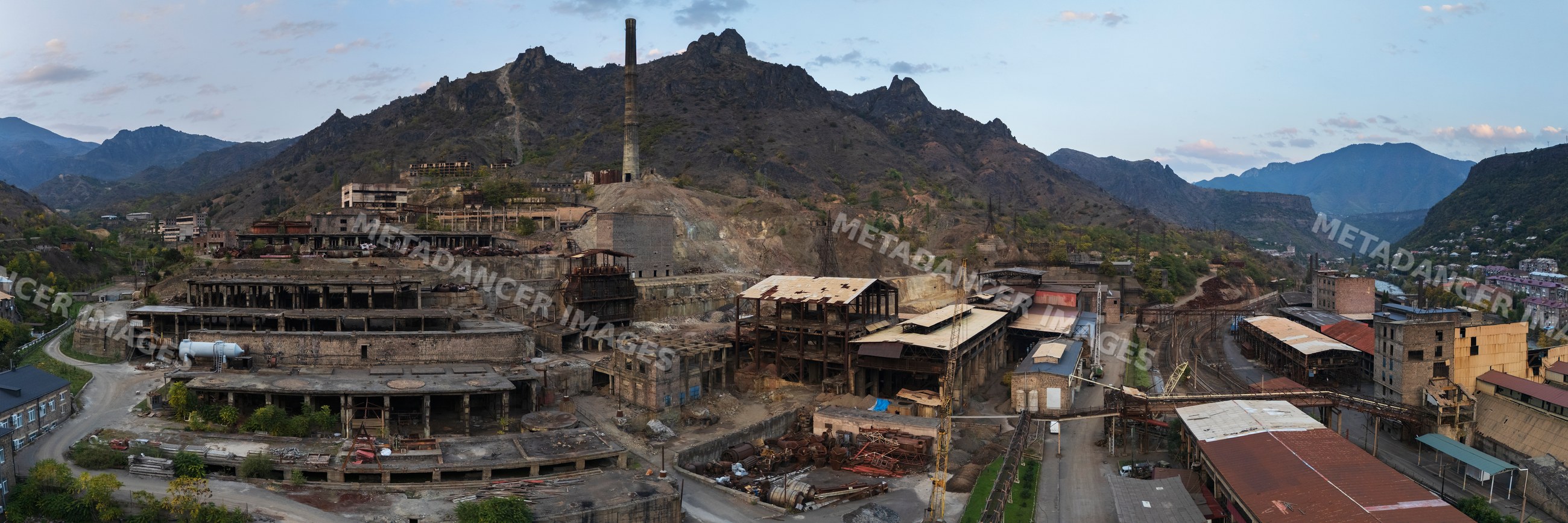 Historic copper mine ruins with industrial buildings in Alaverdi