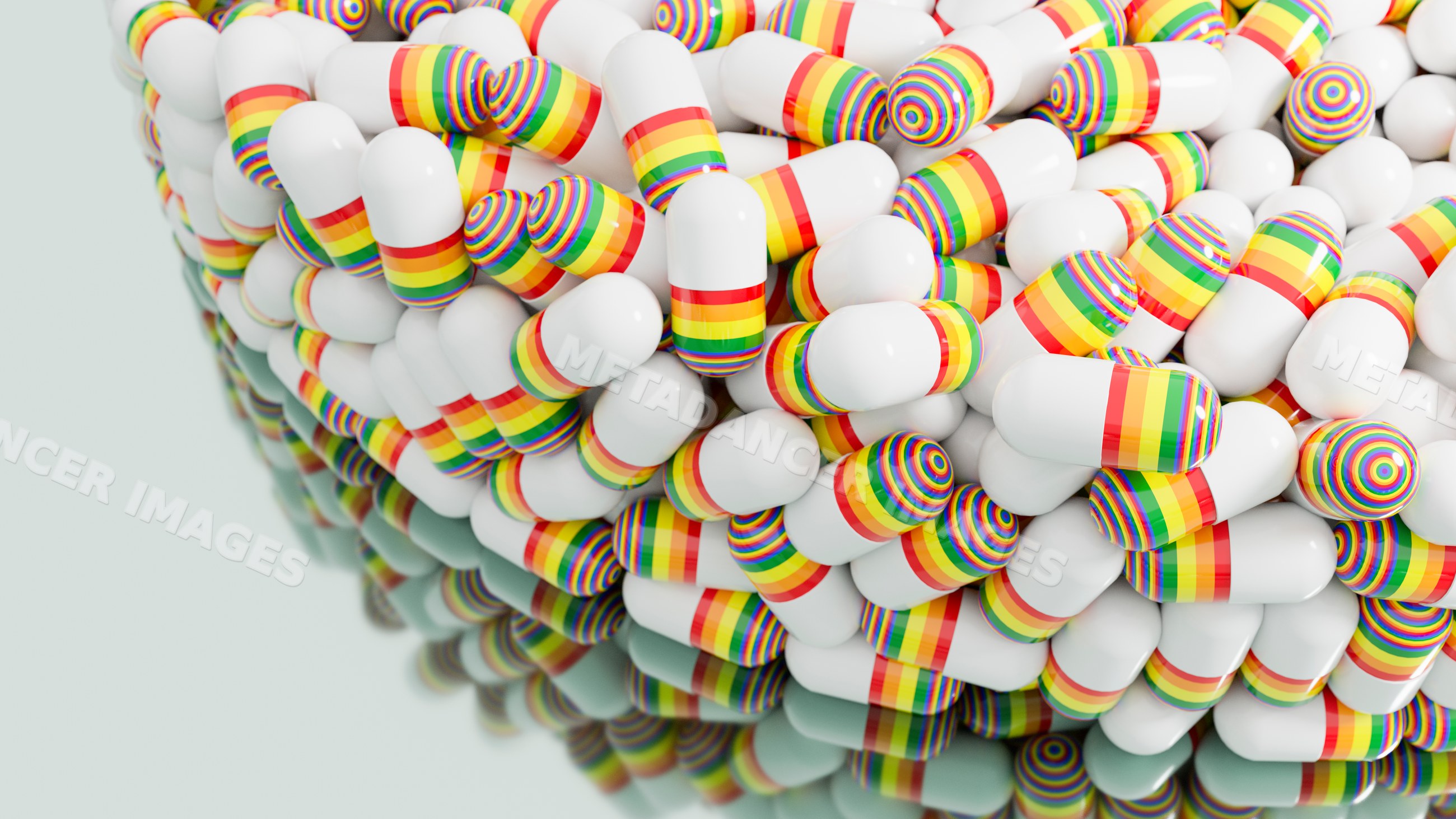 White capsules with rainbow stripes piled close-up