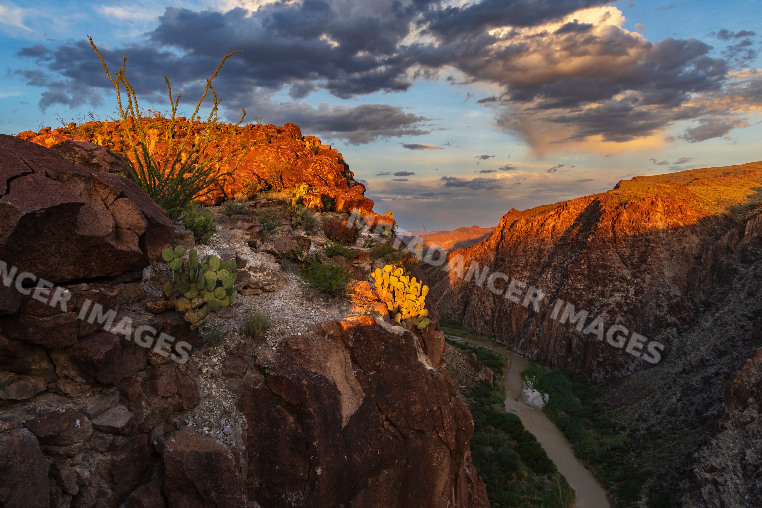Rio Grande River flowing through rocky cliffs at sunset in big bend