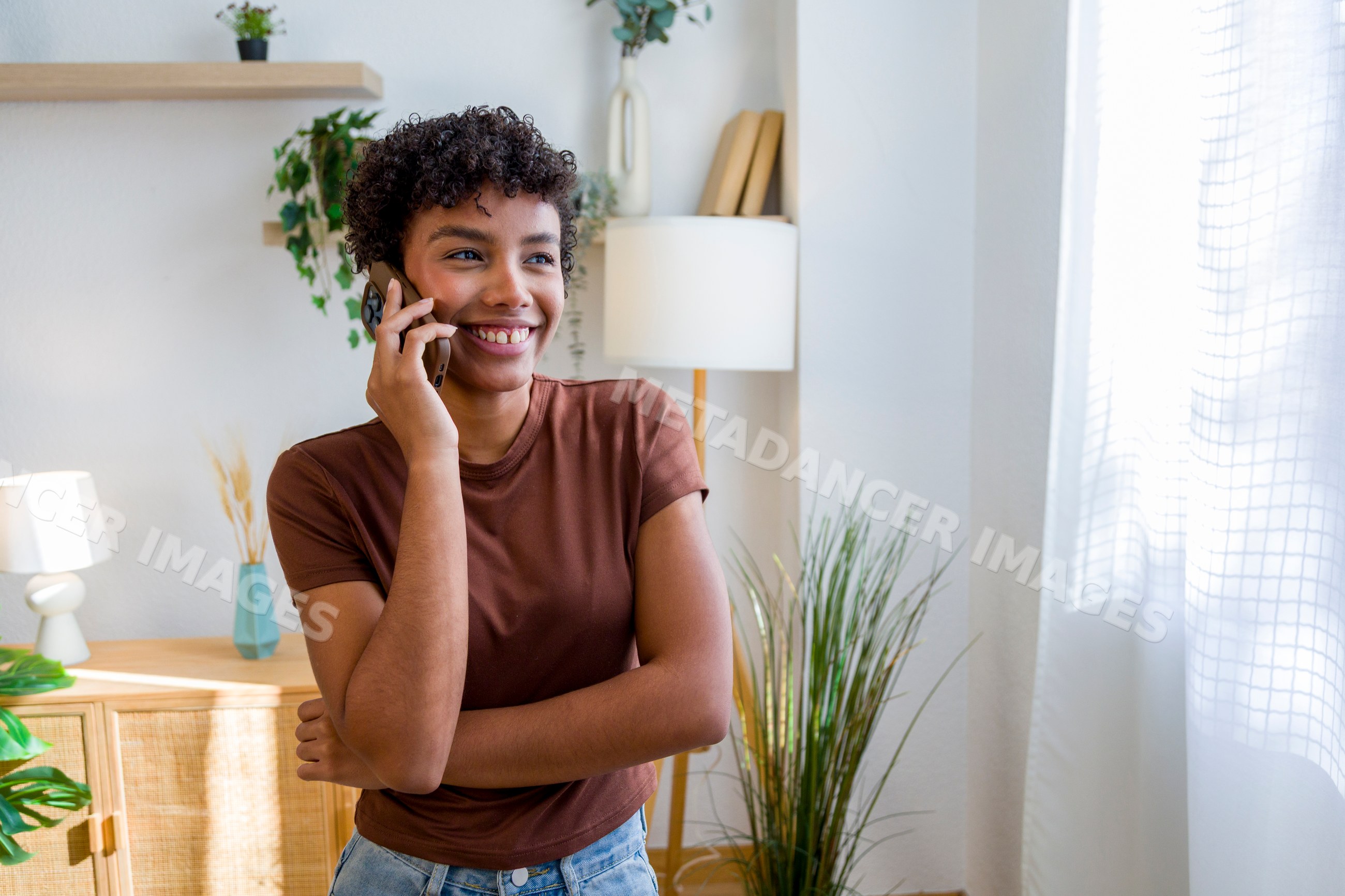 Young African American woman talking on phone