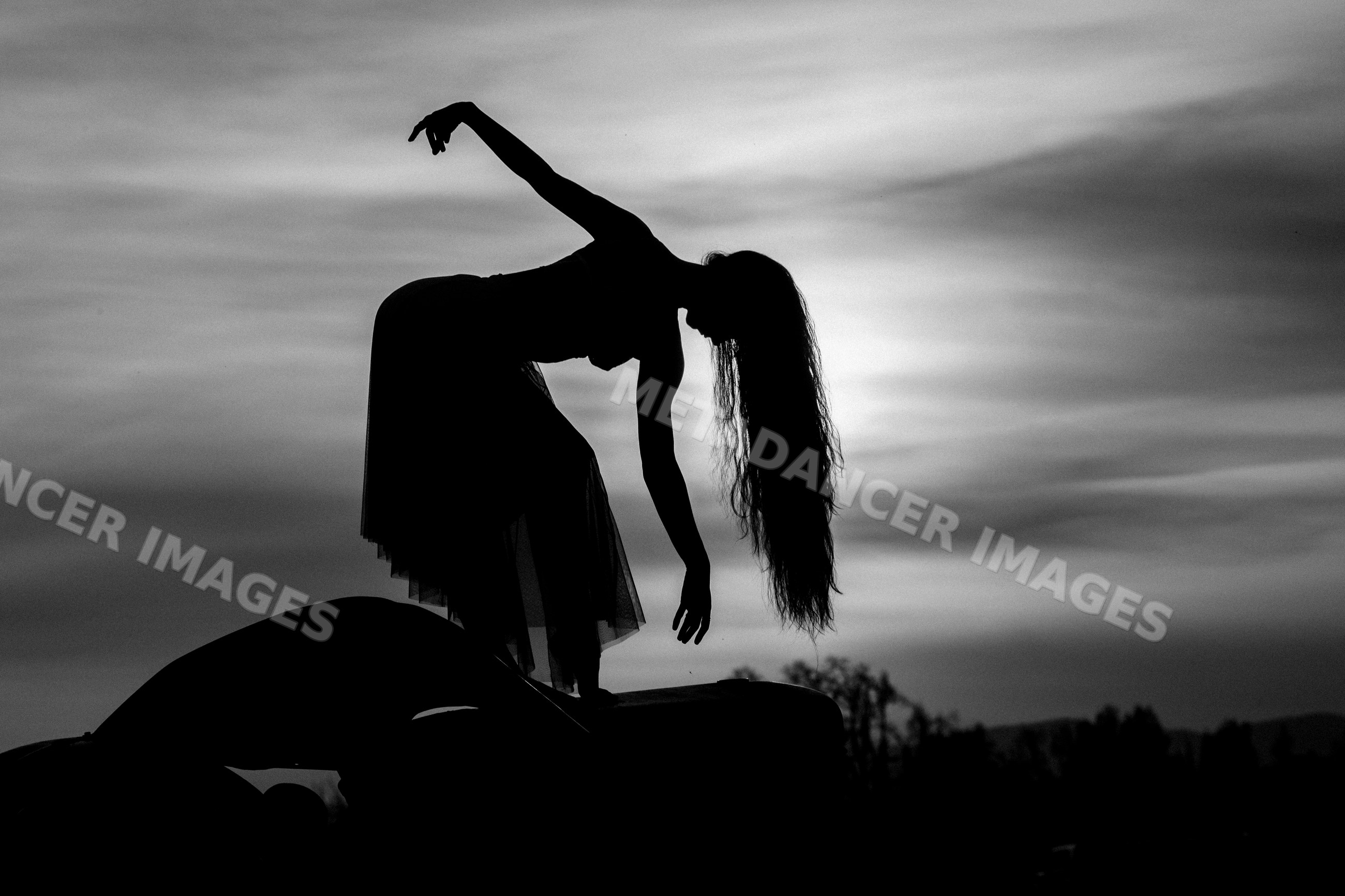 White dancer silhouette balancing