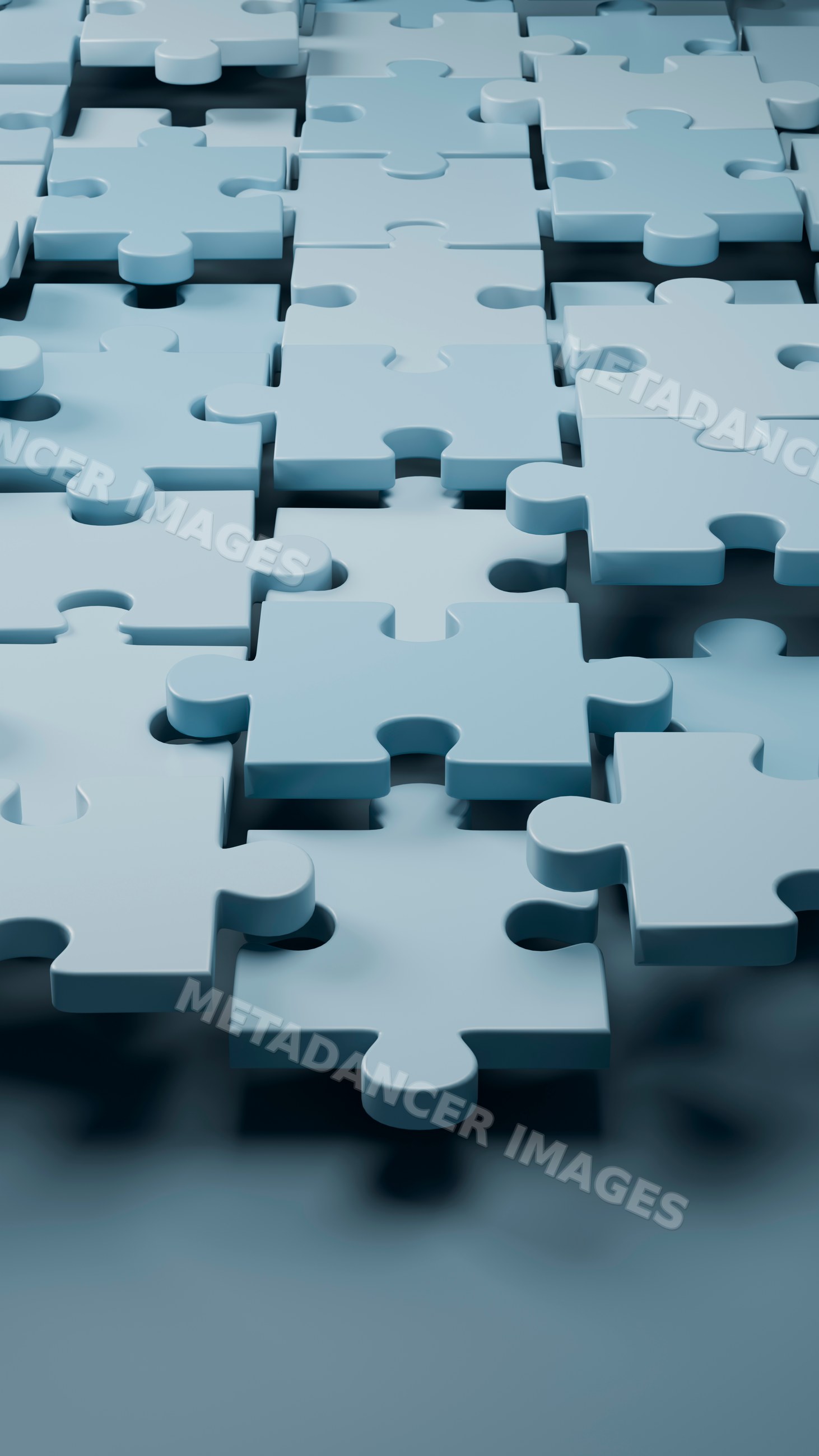 Blue interlocking jigsaw puzzle pieces in a 3d illustration