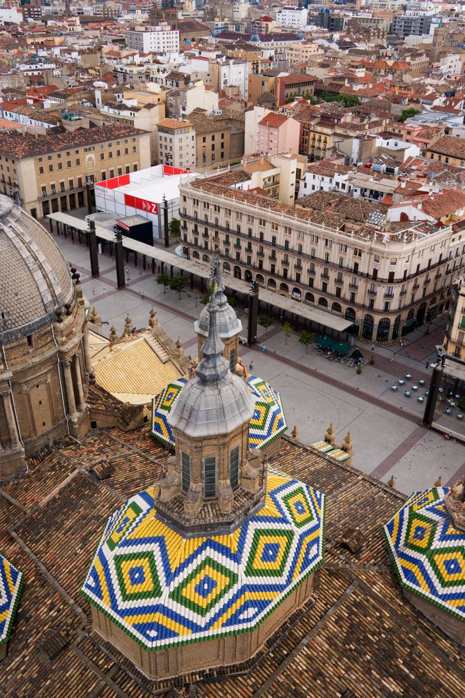 Plaza and basilica with colorful tiled domes, aragon, Spain