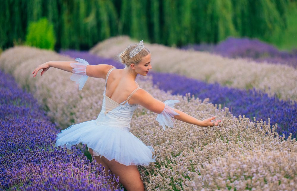 A ballerina dances gracefully in a lavender flower field in WA, USA