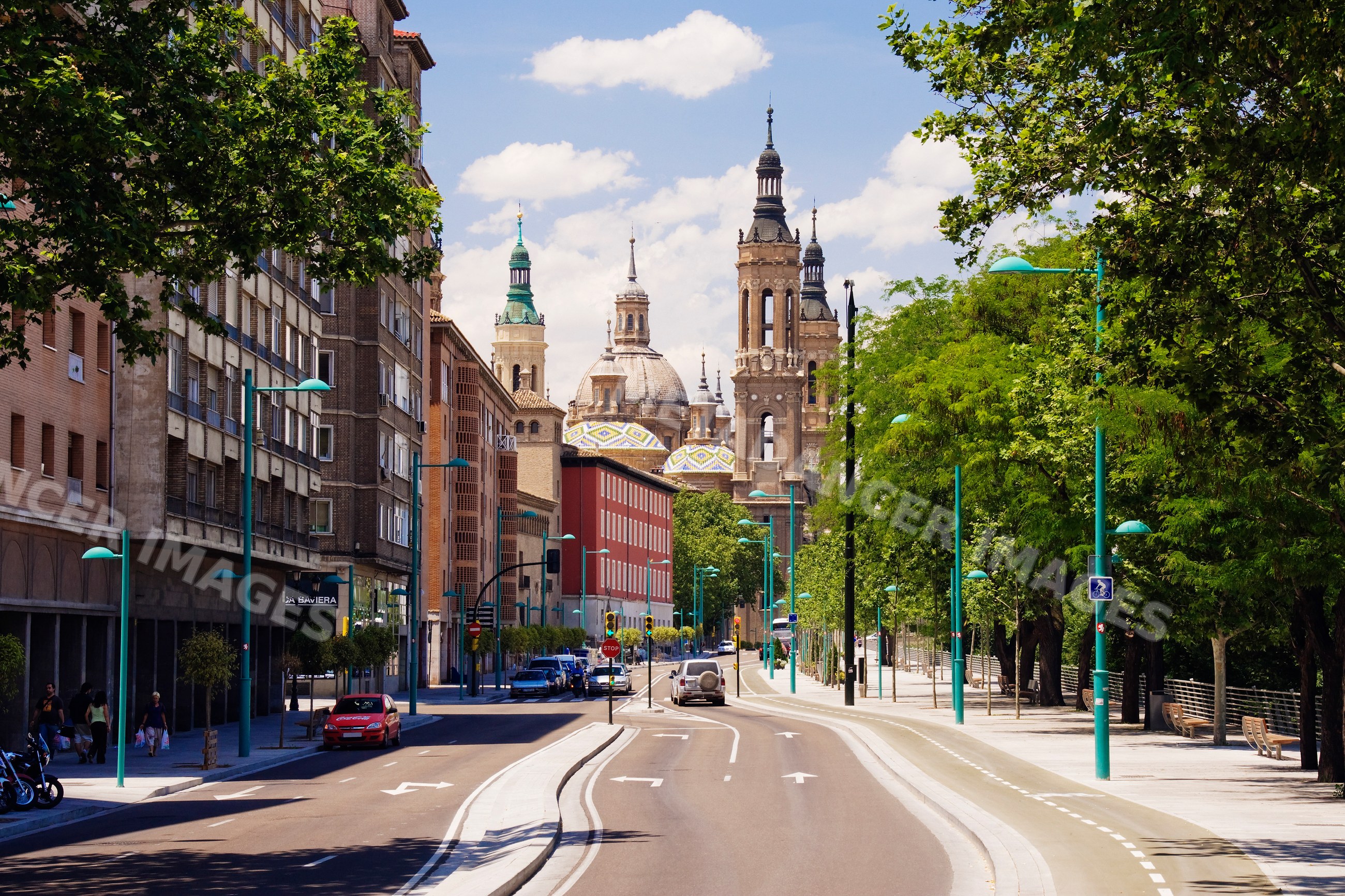 Street view with cathedral and trees in zaragoza aragon Spain