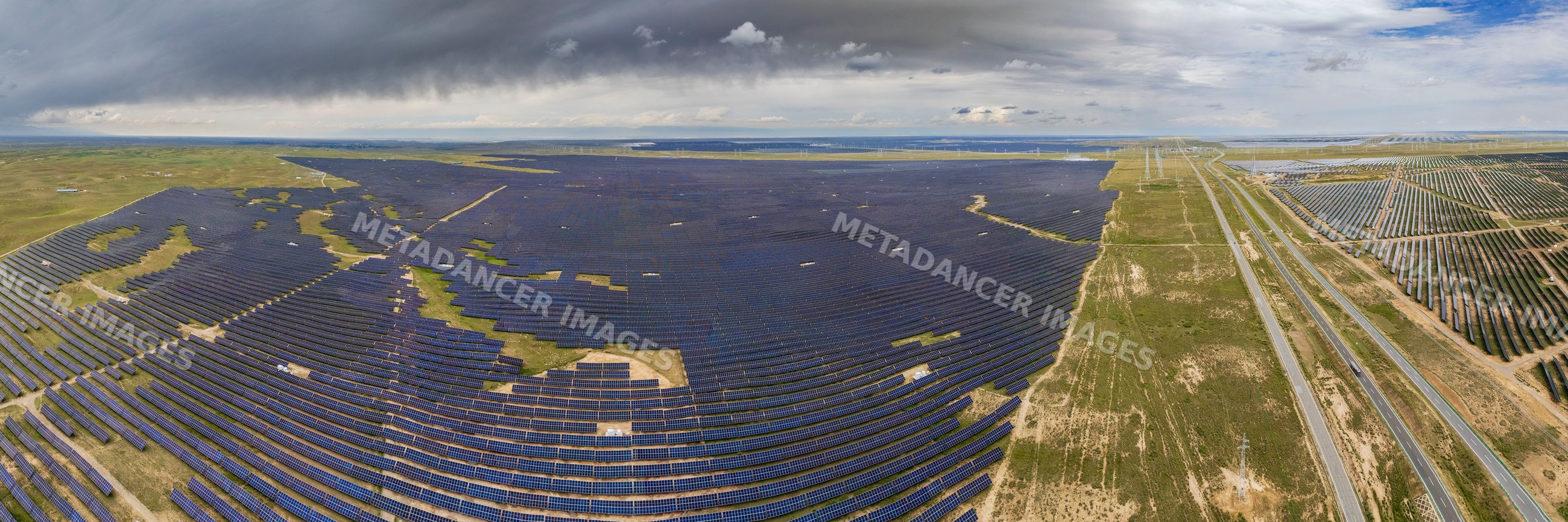 Solar Panels spanning landscape near road