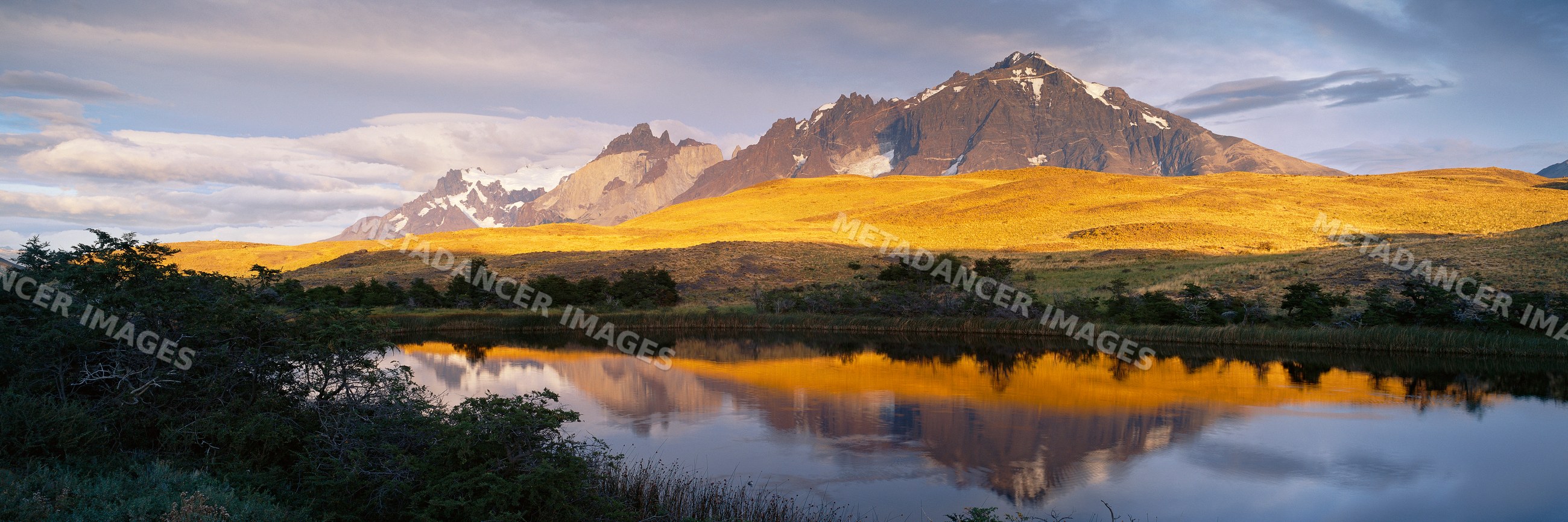 Los cuernos mountain peaks reflected in lake chile