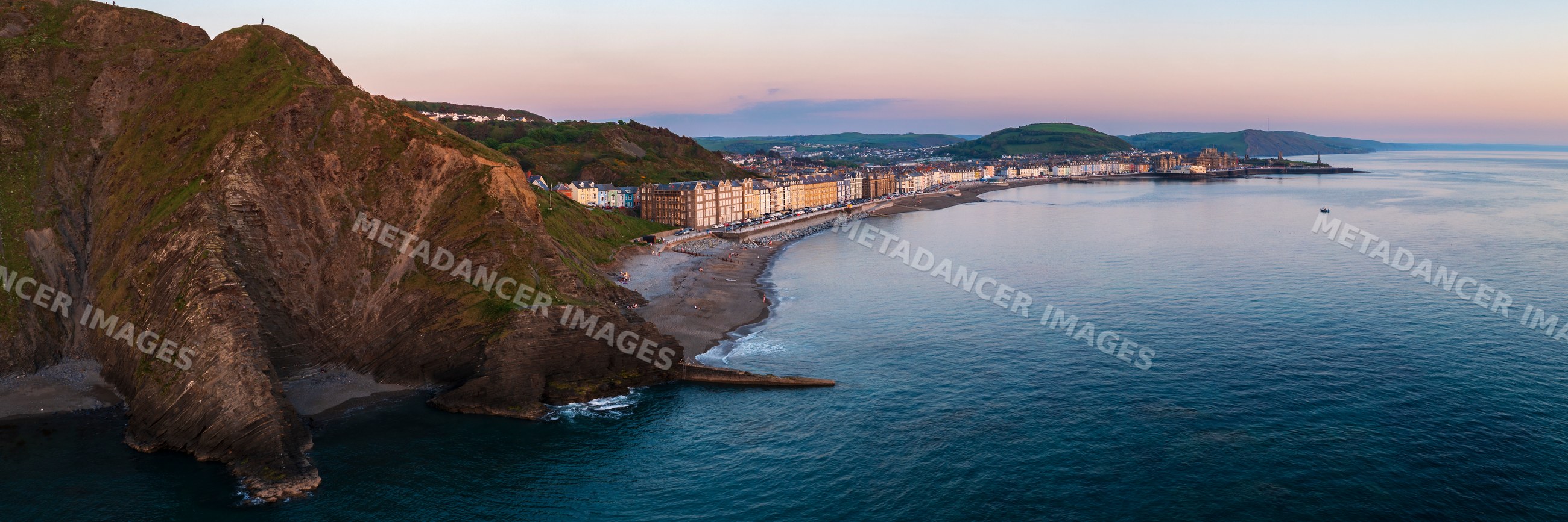 Skyline of Aberystwyth town along the coast at Dusk in Wales