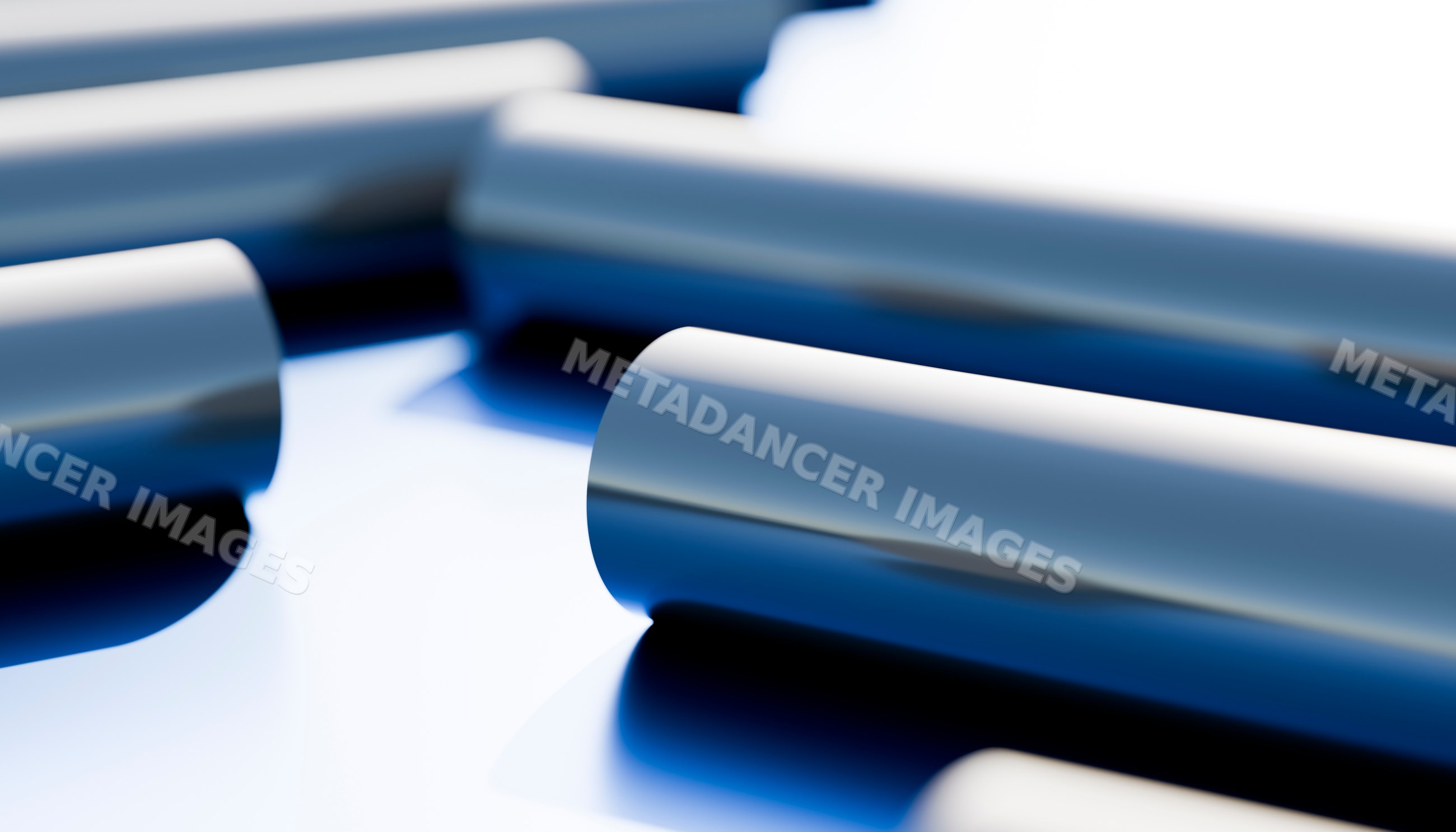Blue metal tubes with reflective surface in an industrial setting