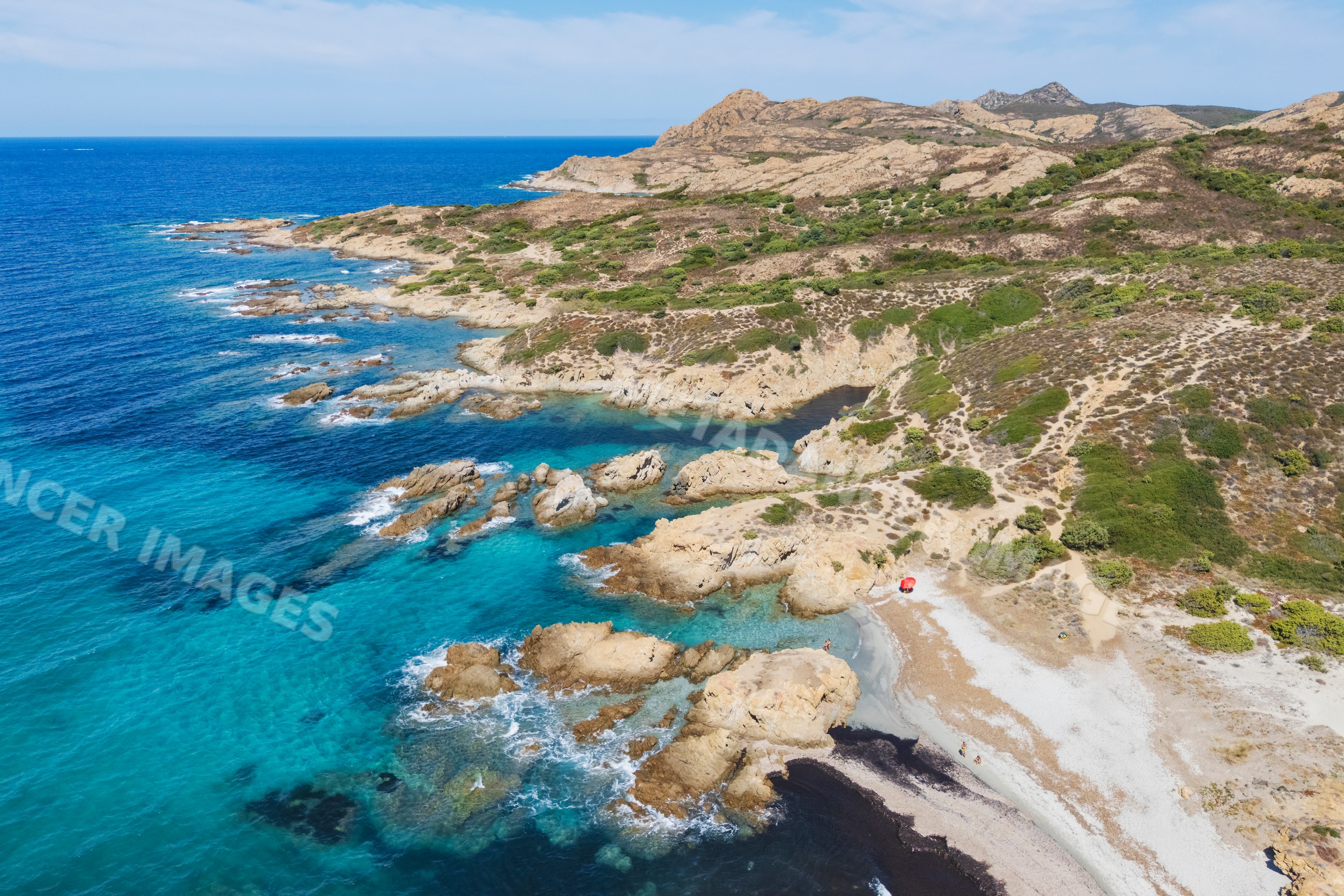 Plage de l'Ostriconi rocky coastline in ile rousse corsica france