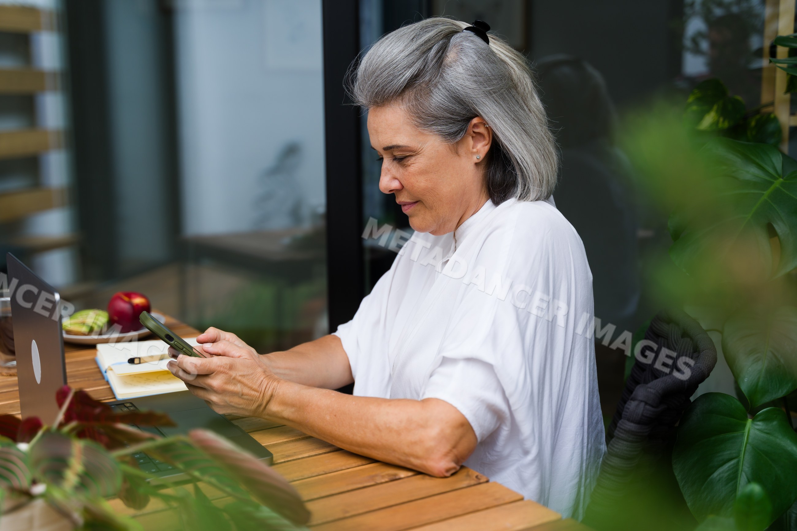Middle-aged white woman using smartphone