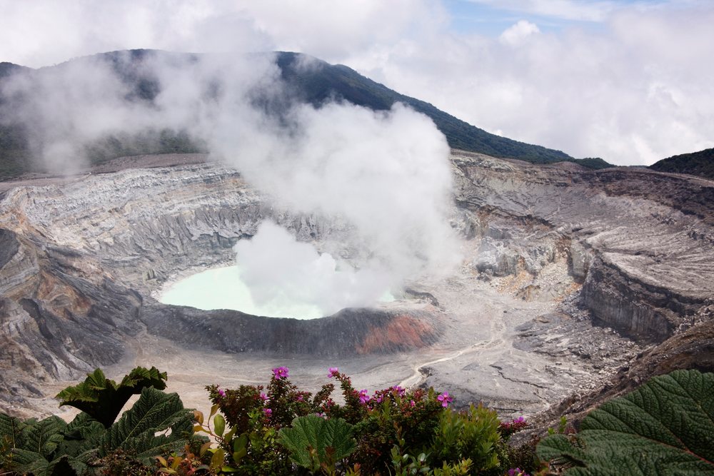 Poas volcano crater with steaming lake