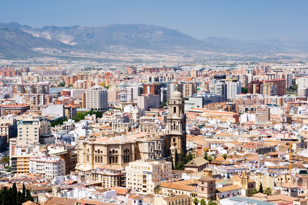 Cityscape of malaga with historic buildings and mountains Spain