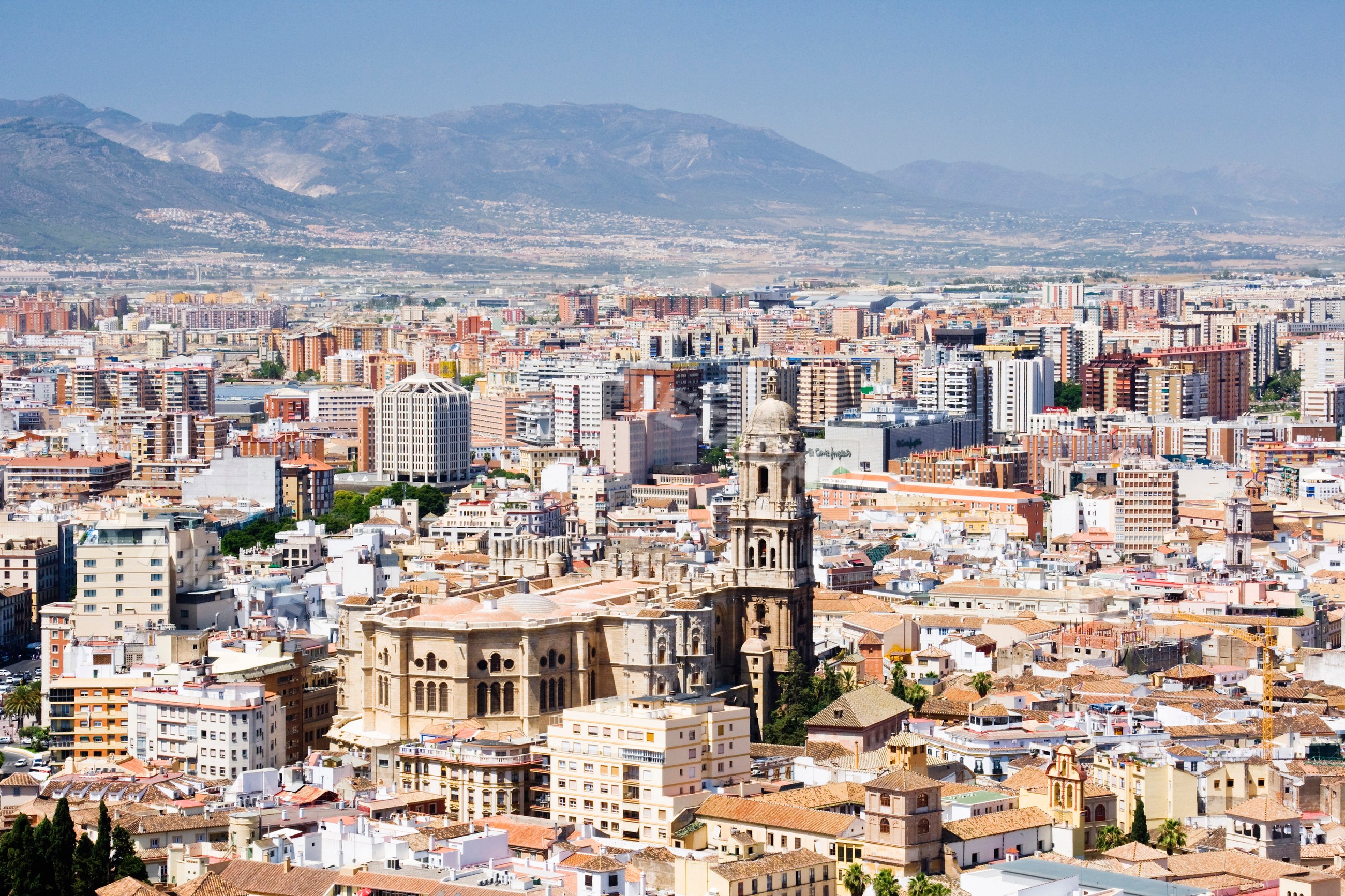 Cityscape of malaga with historic buildings and mountains Spain