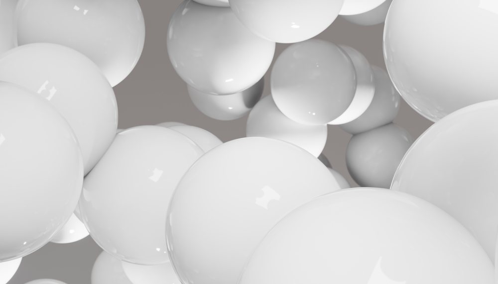 Glossy white spheres clustered together in an abstract design
