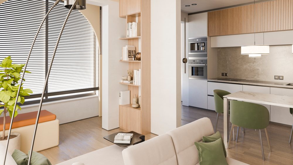 Modern kitchen and dining room with wooden flooring and green chairs