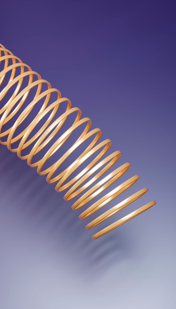 Golden metallic slinky toy coiled against smooth purple background