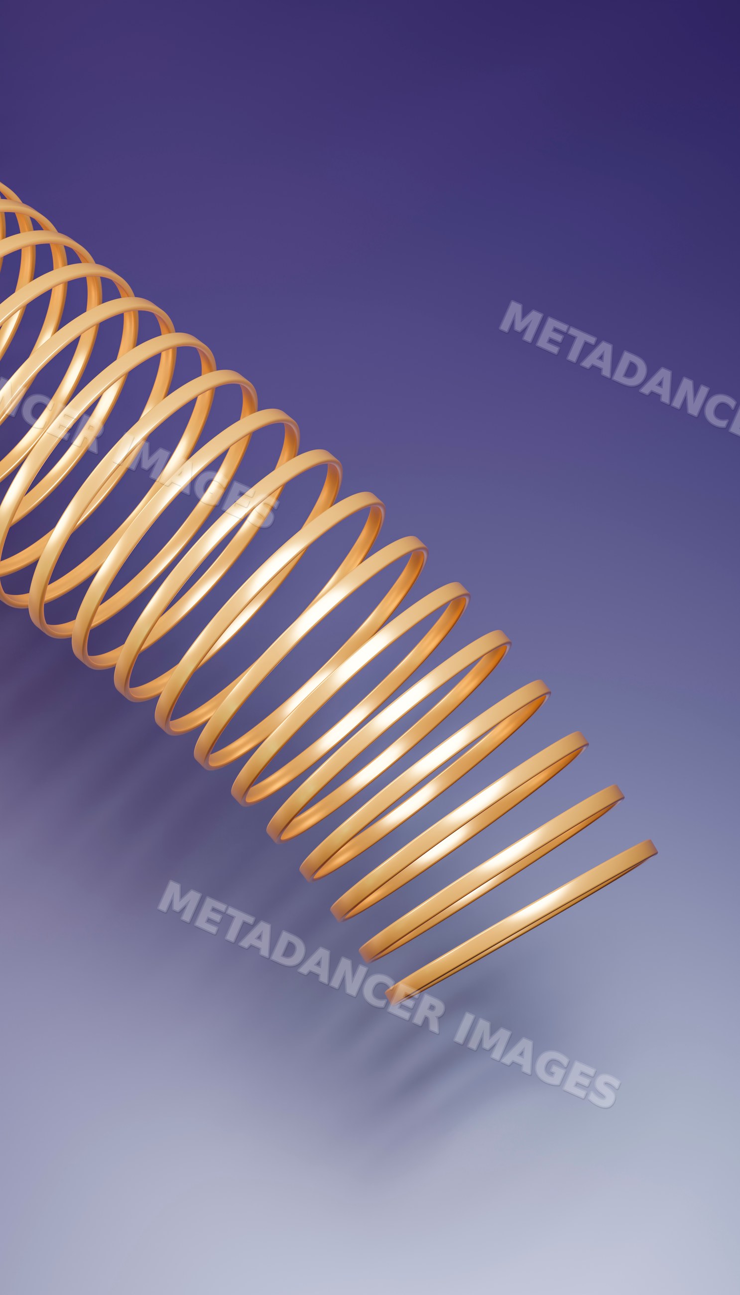 Golden metallic slinky toy coiled against smooth purple background
