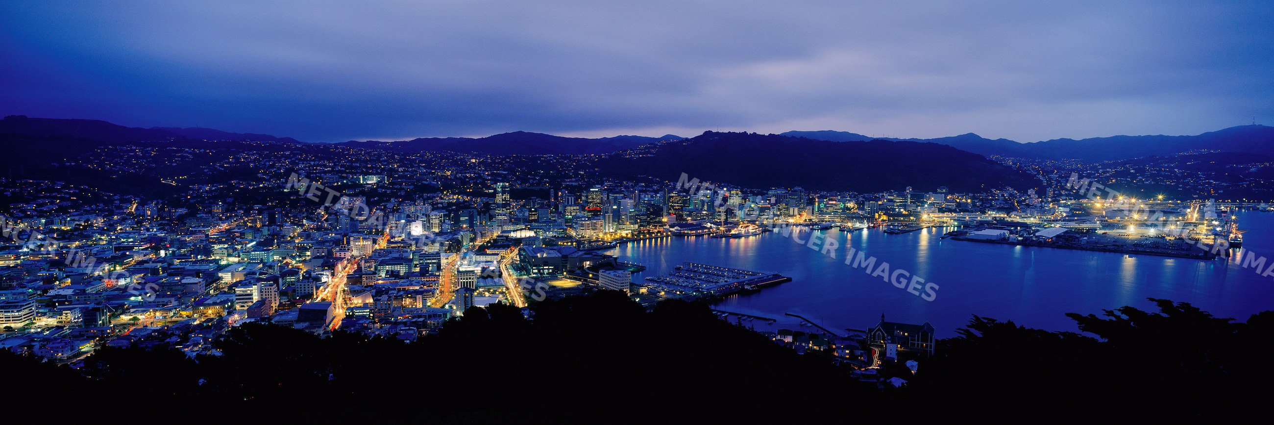 Wellington cityscape and harbor illuminated at night
