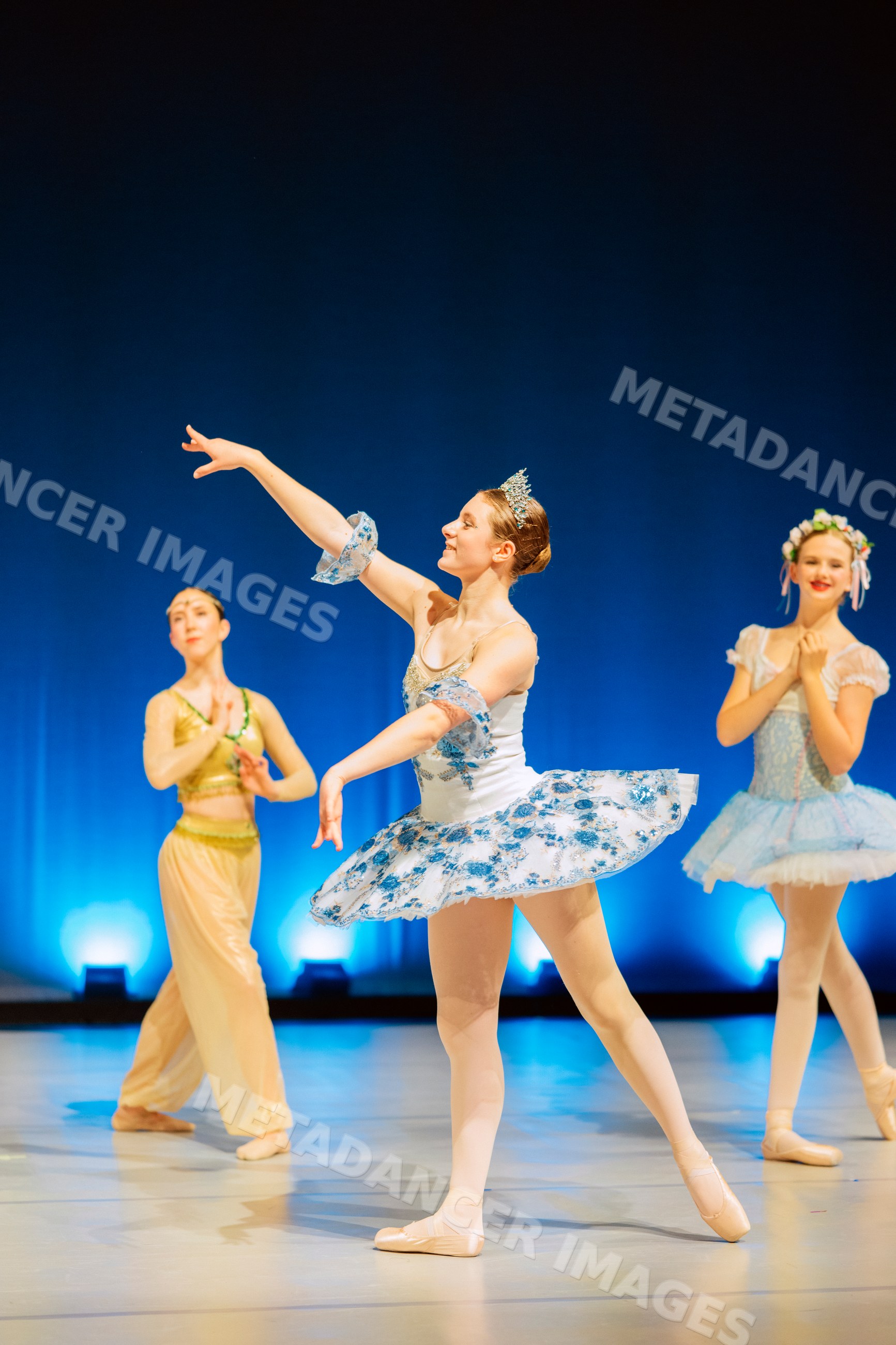 A ballerina performs a graceful dance on stage during a ballet recital