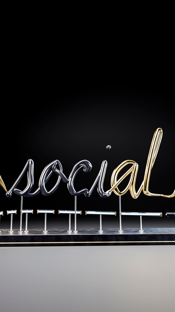 Metal sculpture spelling 'social' in a modern art setting