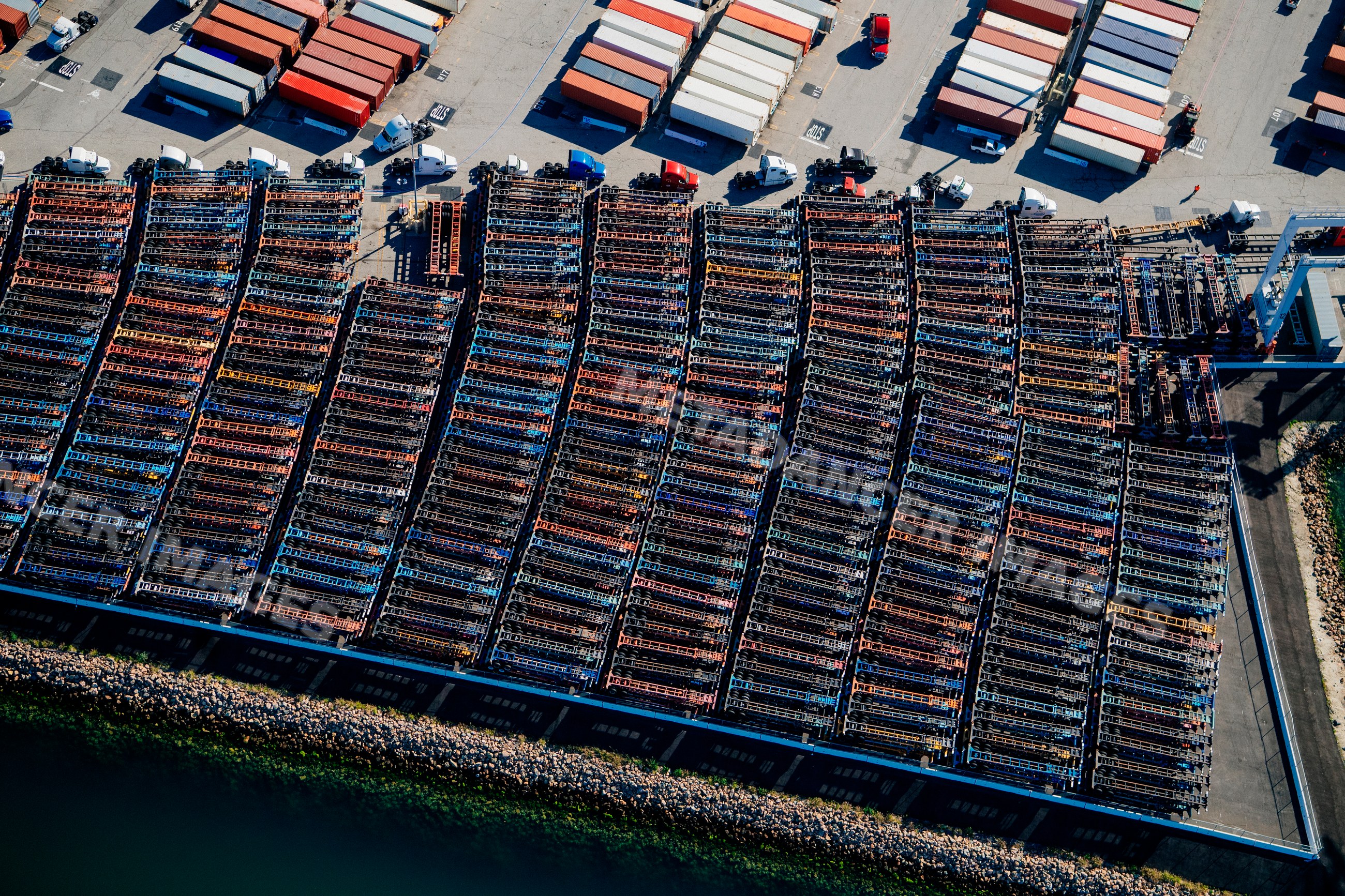 Shipping container trailers and semi trucks parked