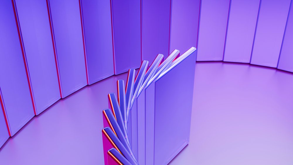 Falling dominoes arranged in a purple-lit curved line illustration