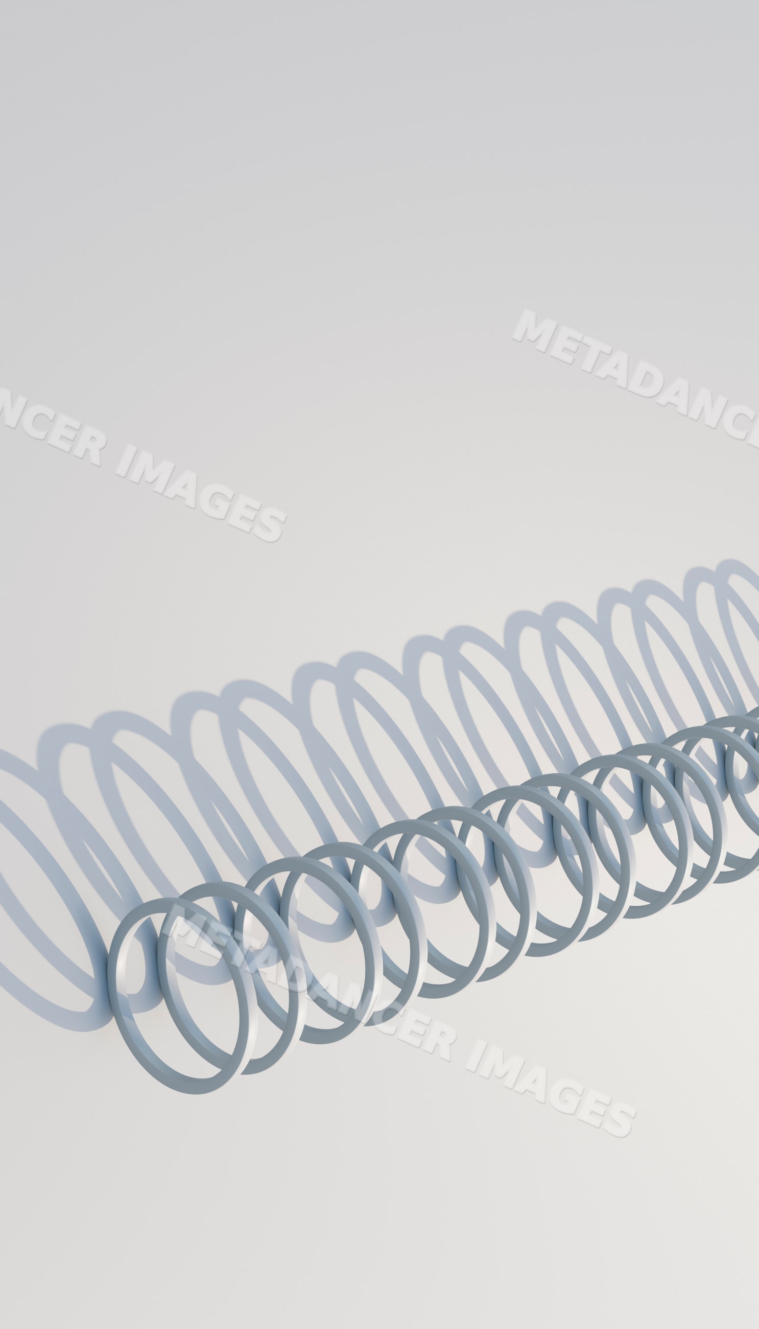 A metal coil casting repeating shadows on a white background