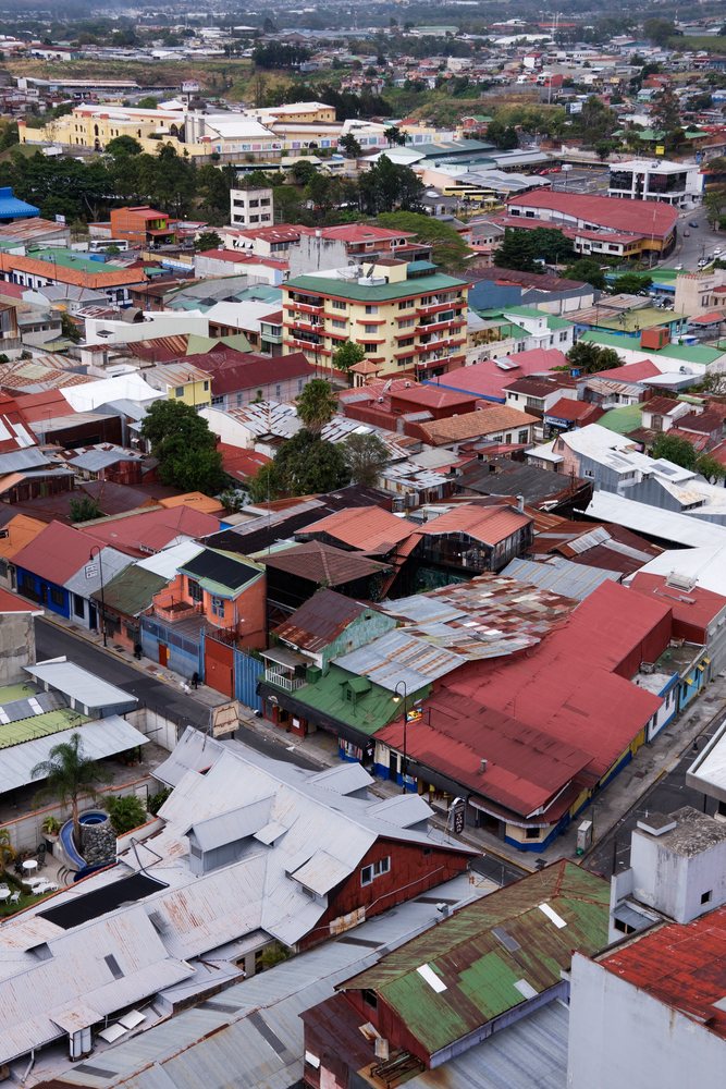 Aerial view of urban buildings and rooftops in a dense neighborhood